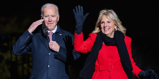 U.S. President Joe Biden, left, and First Lady Jill Biden attend the National Christmas Tree lighting on the Ellipse in Washington, D.C., U.S., on Thursday, Dec. 2, 2021. Biden today called on health providers to expand the availability of coronavirus vaccines and booster shots, aiming to combat a winter surge of infections, and hold off the new omicron variant. 