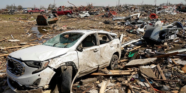 A vehicle awaits removal Saturday March 25, 2023, after getting destroyed by a Friday night tornado that hit Rolling Fork, Miss.  Emergency officials in Mississippi say several people have been killed by tornadoes that tore through the state on Friday night, destroying buildings and knocking out power as severe weather produced hail the size of golf balls moved through several southern states. 