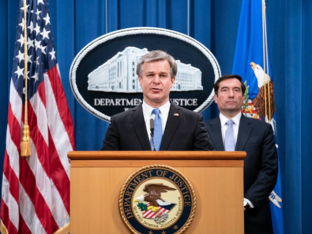 FBI Director Christopher Wray speaks during a virtual news conference at the Department of Justice on October 28, 2020 in Washington, DC. - Five Chinese agents have been arrested in the United States for their role in an operation targeting opponents of the Chinese government, US officials announced on October 28, 2020. Assistant Attorney General John Demers said charges had been filed against eight people involved in an "illegal Chinese law enforcement operation known as Fox Hunt." (Photo by Sarah Silbiger / POOL / AFP) (Photo by SARAH SILBIGER/POOL/AFP via Getty Images)