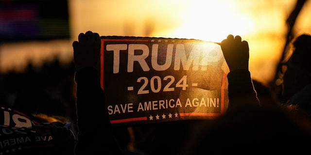 Trump supporters await his arrival at a rally for Ohio Republicans at the Dayton International Airport on November 7, 2022 in Vandalia, Ohio.