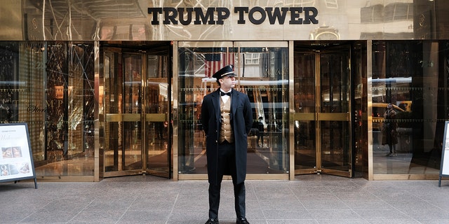 A doorman stands outside Trump Tower in Manhattan.