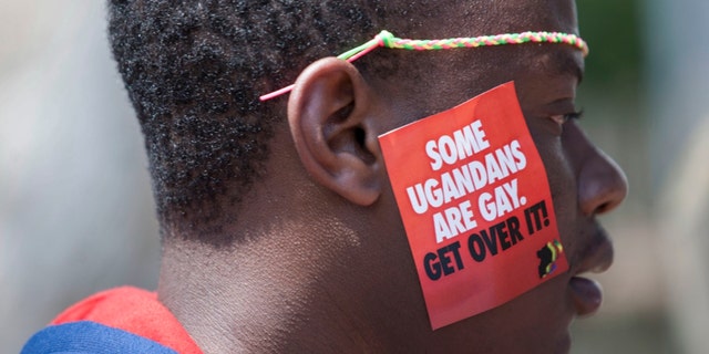A Ugandan man is seen during the third Annual Lesbian, Gay, Bisexual and Transgender Pride celebrations in Entebbe, Uganda on Aug. 9, 2014.