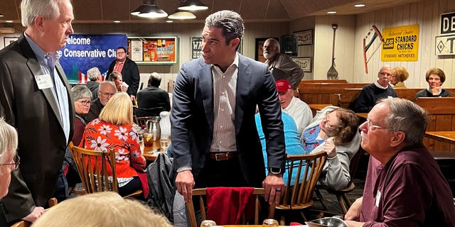 Mayor Francis Suarez of Miami, Florida (center) speaks with Republican leaders and activists at a meeting of the Westside Conservative Club, on March 22, 2023 in Urbandale, Iowa