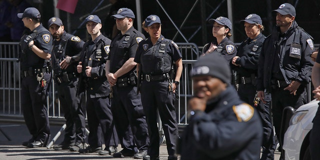 NYPD officers guarded the Manhattan Criminal Courthouse as former President Trump was arraigned Tuesday following his indictment by a grand jury.