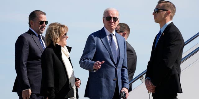 President Biden gestures before he walked over to talk with reporters before boarding Air Force One at Andrews Air Force Base, Maryland.