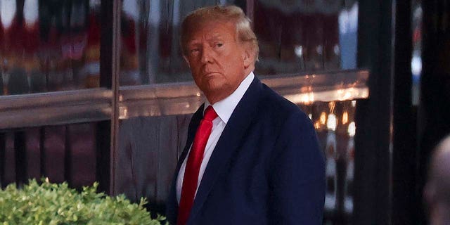 Former President Donald Trump arrives at Trump Tower on April 3, 2023, in New York City. Trump returned to New York for his expected booking and arraignment Tuesday on charges arising from hush-money payments during his 2016 presidential campaign.