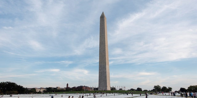 White flags honoring the lives lost to COVID-19 are seen on the National Mall in Washington, D.C., the United States, on Oct. 2, 2021.  