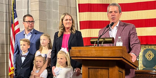 Republican Nebraska Gov. Jim Pillen (right) appointed former prosecutor Carolyn Bosn (center) to the state Legislature on Thursday.