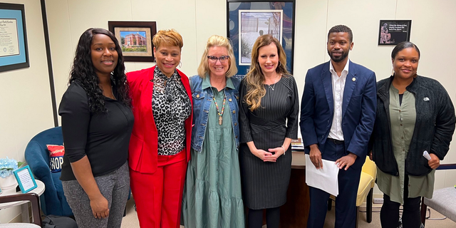 North Carolina state Rep. Tricia Cotham, third from right, after discussion with parents from Charlotte on education.