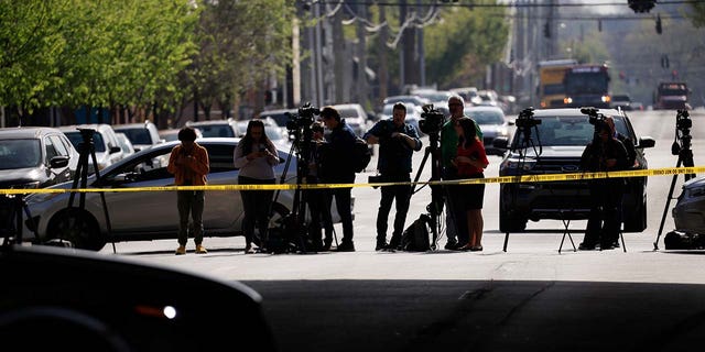 LOUISVILLE, KY - APRIL 10: Members of the media work at the scene of an active shooter at the Old National Bank building on April 10, 2023 in Louisville, Kentucky. According to reports, there are multiple fatalities and casualties. The shooter died at the scene. 