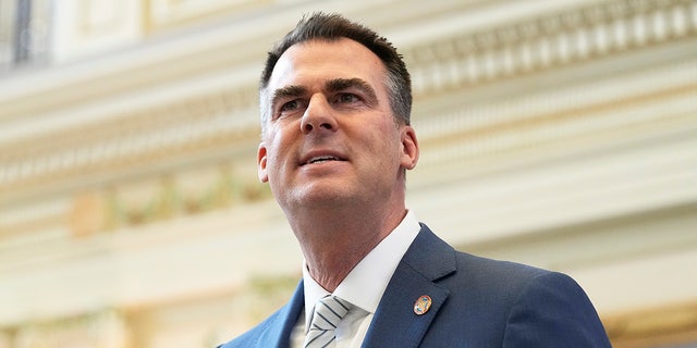 Republican Oklahoma Gov. Kevin Stitt has called for four McCurtain County officials to resign after recordings of them talking about knowing hitmen whilst complaining about two journalists whom they disliked were released.