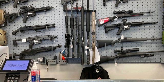 Guns are displayed at a shop in Salem, Ore., Feb. 19, 2021.