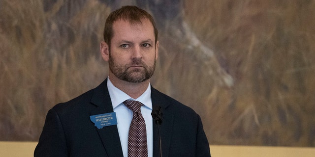 Matt Regier wearing a suit and tie