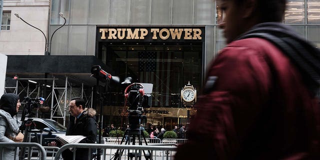 People walk by Trump Tower the morning after former president Donald Trump was indicted by a New York jury on March 31, 2023, in New York City. 