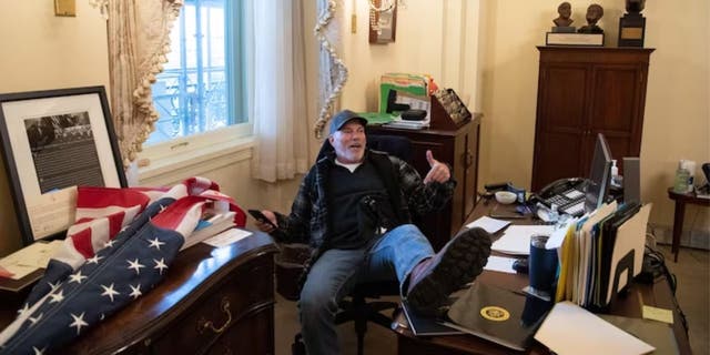 Bigo with his feet up on Nancy Pelosi's desk