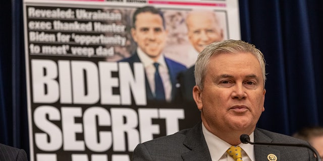 Comer in front of billboard of New York Post Hunter Biden frontpage