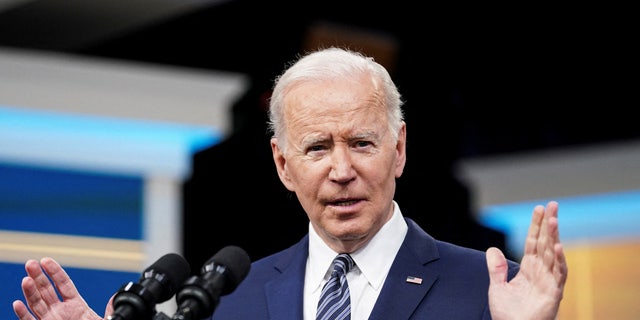 President Joe Biden speaking at podium