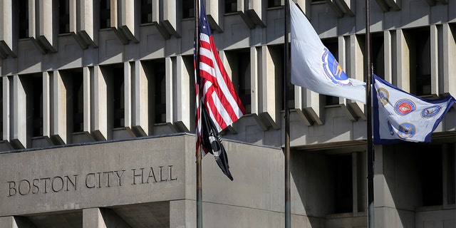 Boston City Hall with flags raised outside