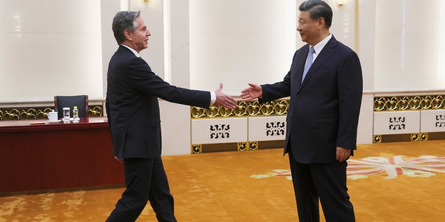 Blinken, Xi Jinping shaking hands