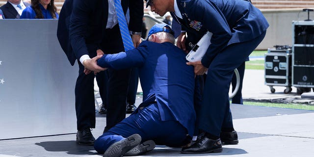 Biden falls at Air Force Academy