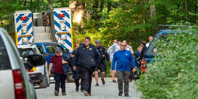 Search and rescue teams walk away from scene