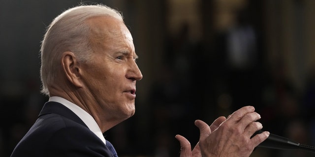 U.S. President Biden speaking with his hands up