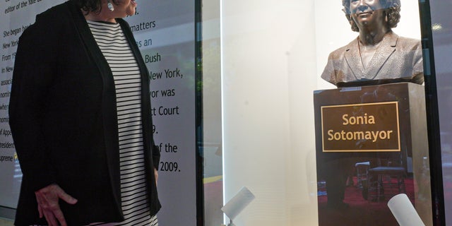 Supreme Court Associate Justice Sonia Sotomayor looks at a bronze bust of herself after it was unveiled at the Bronx Terminal Market on Sept. 8, 2022 in the Bronx borough of New York City.