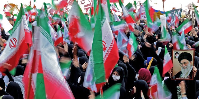 Iranian flags waved outside former US embassy