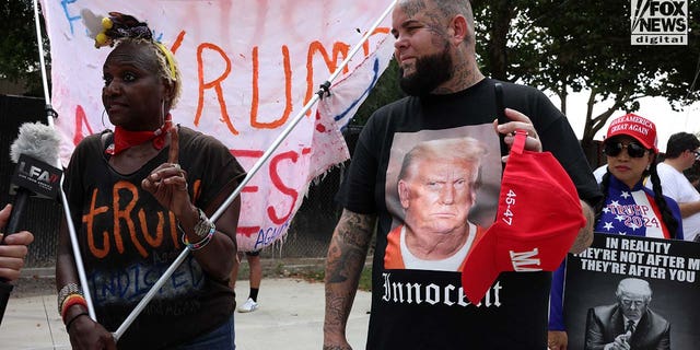 Supporters and counter protesters outside fulton county jail