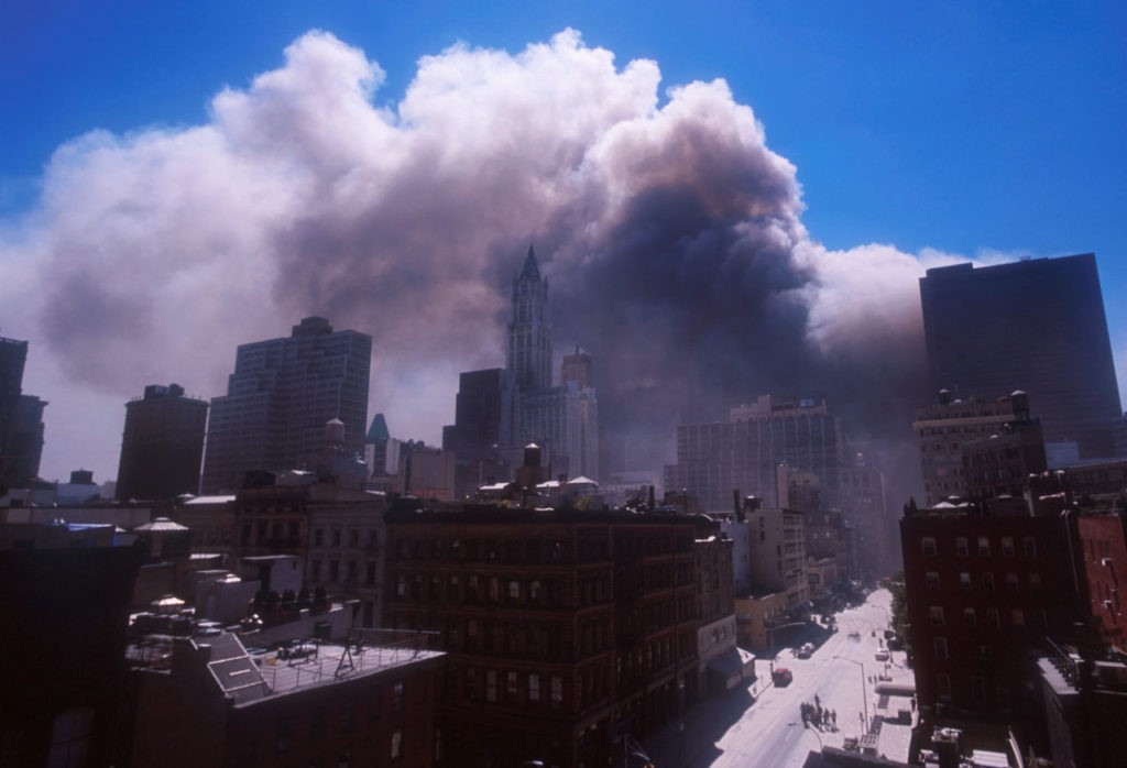 394273 10: Smoke billows from the World Trade Center's twin towers after they were struck by commerical airliners in a suspected terrorist attack September 11, 2001 in New York City. (Photo by Ezra Shaw/Getty Images)