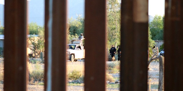 Mexican National Guard and state police stand by on the southern side of the border barrier. (Randy Clark/Breitbart Texas)