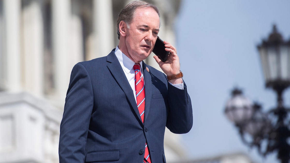 Rep. John Joyce, R-Pa. on the steps of the Capitol with phone