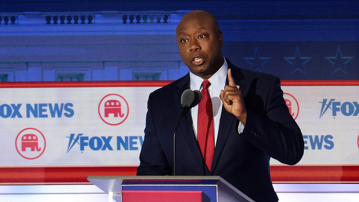 Tim Scott speaks at podium