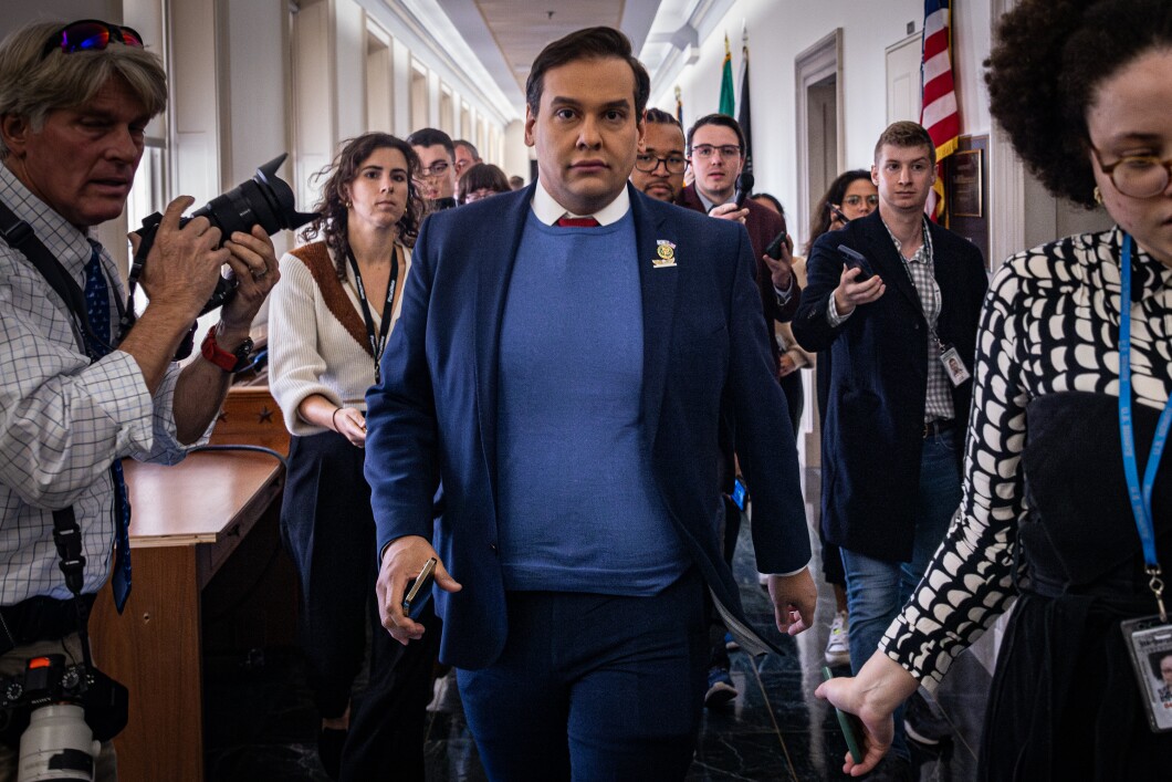 Rep. George Santos (R-NY) leaves a House Republican conference meeting to nominate a speaker of the House, Capitol Hill, on Wednesday, Oct. 11, 2023. According to a new indictment announced Tuesday, Oct. 10, Santos allegedly stole the identities of donors to his campaign and then used their credit cards to make tens of thousands of dollars in unauthorized charges. 