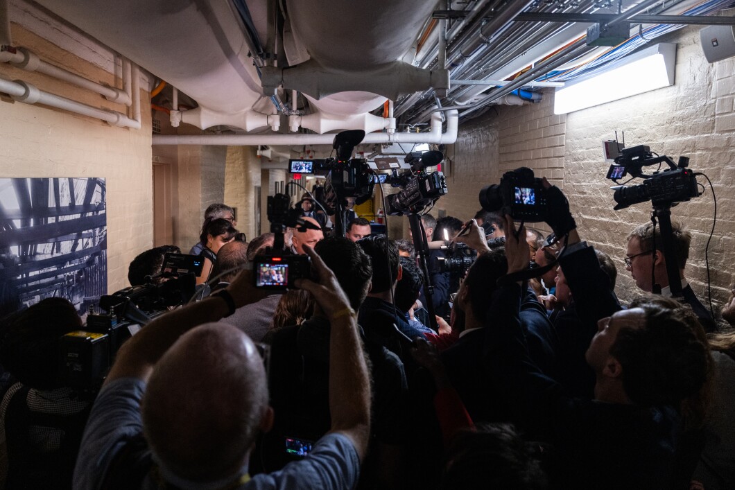 Members of the press gather in the basement of the Capitol to speak to House lawmakers on their way to a conference meeting, on Thursday, Oct. 12, 2023.