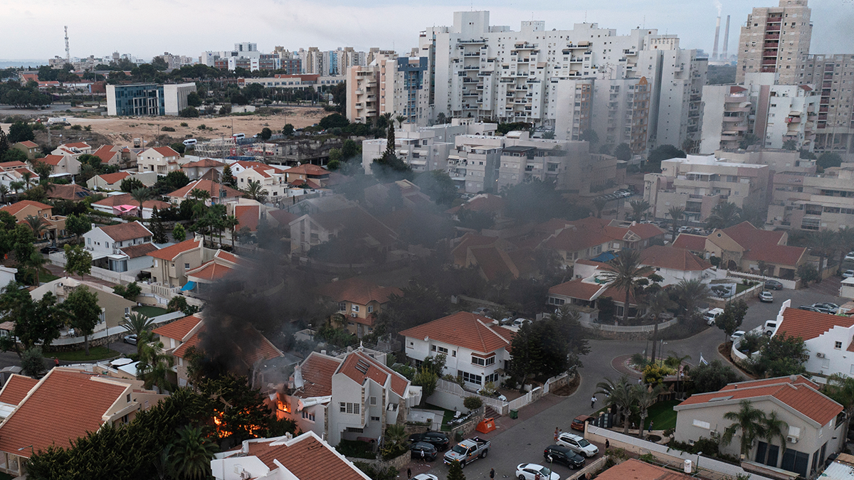 smoke over house hit by rocket