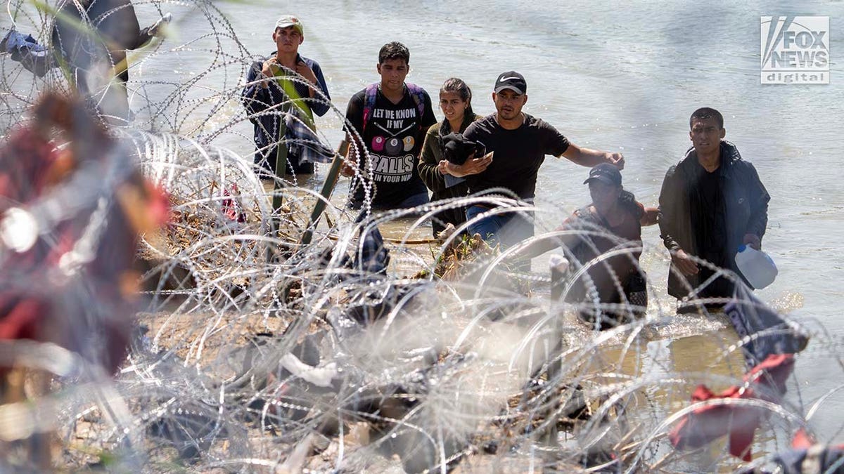 Migrants cross the Rio Grande River to enter the American Border