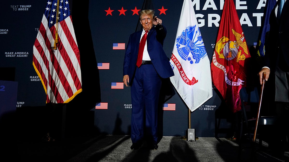 Trump points to a supporter at New Hampshire event