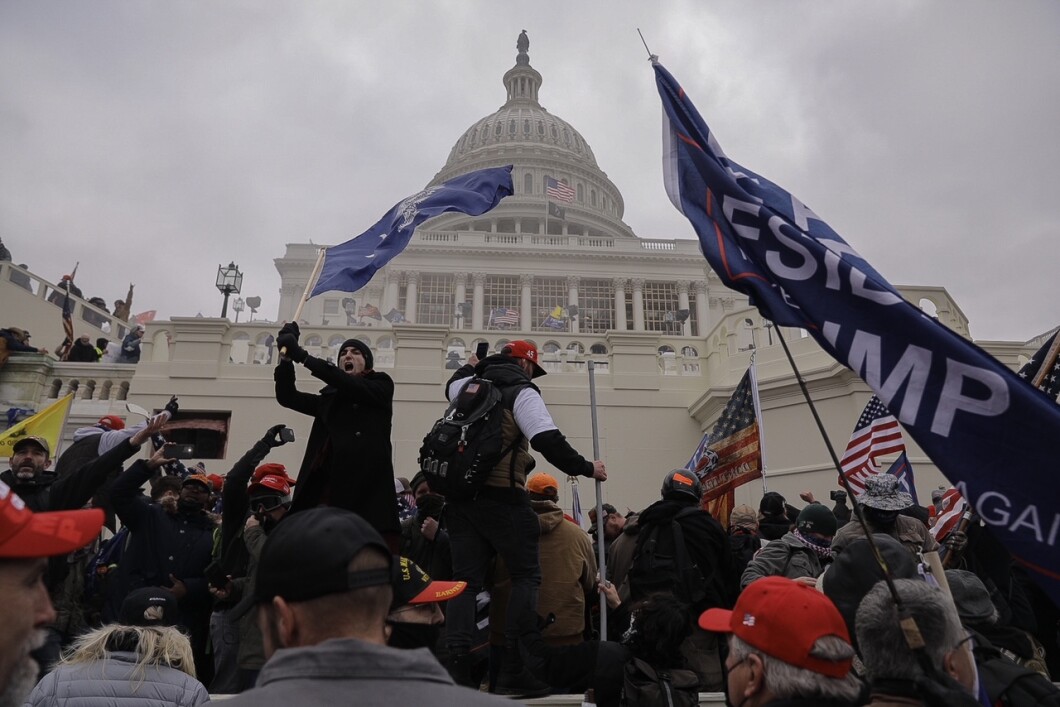 Supporters of Donald Trump are seen waving flags in front of the Capitol in Washington on Jan. 6, 2021.