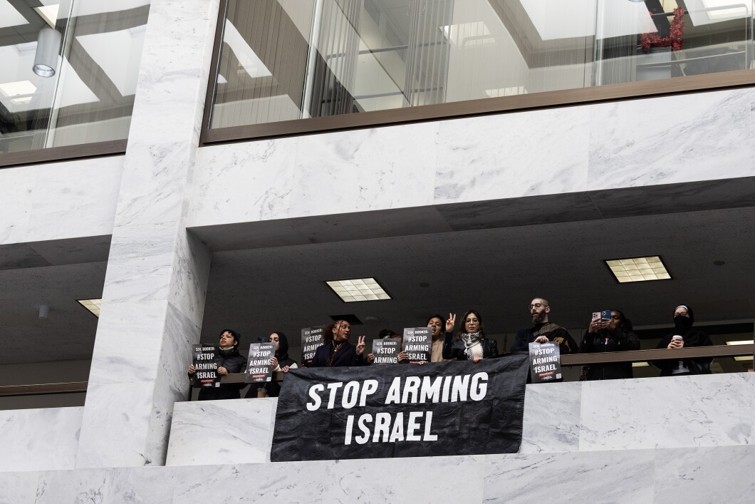 Anti-war activists protest outside the office of Sen. Cory Booker's (D-NJ) office in the Hart Senate Office Building on Capitol Hill, Friday, Nov. 3, 2023. House Republicans have approved a $14.5 billion military aid package for Israel amid the escalating conflict with Hamas in Gaza.