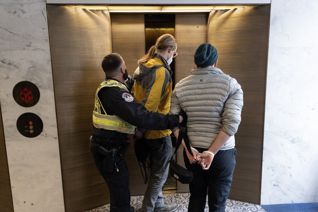 Capitol Police arrest an anti-war activist in the Hart Senate Office Building on Capitol Hill, Friday, Nov. 3, 2023. House Republicans have approved a $14.5 billion military aid package for Israel, amid the escalating conflict with Hamas in Gaza. 