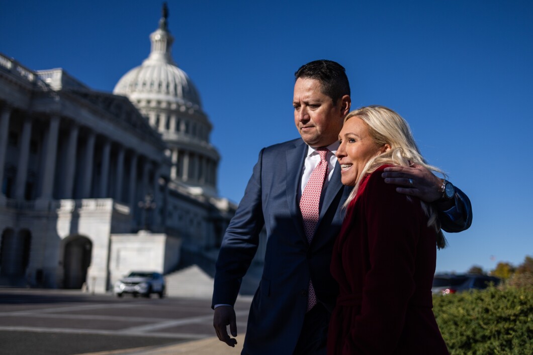 Rep. Tony Gonzales (R-TX) and Rep. Marjorie Taylor Greene (R-GA) talk with one another following a news conference on border security on Capitol Hill on Nov. 14, 2023, in Washington. Greene criticized eight GOP members who defected against her tabled attempt to remove Homeland Security Secretary Alejandro Mayorkas from the Biden administration. 