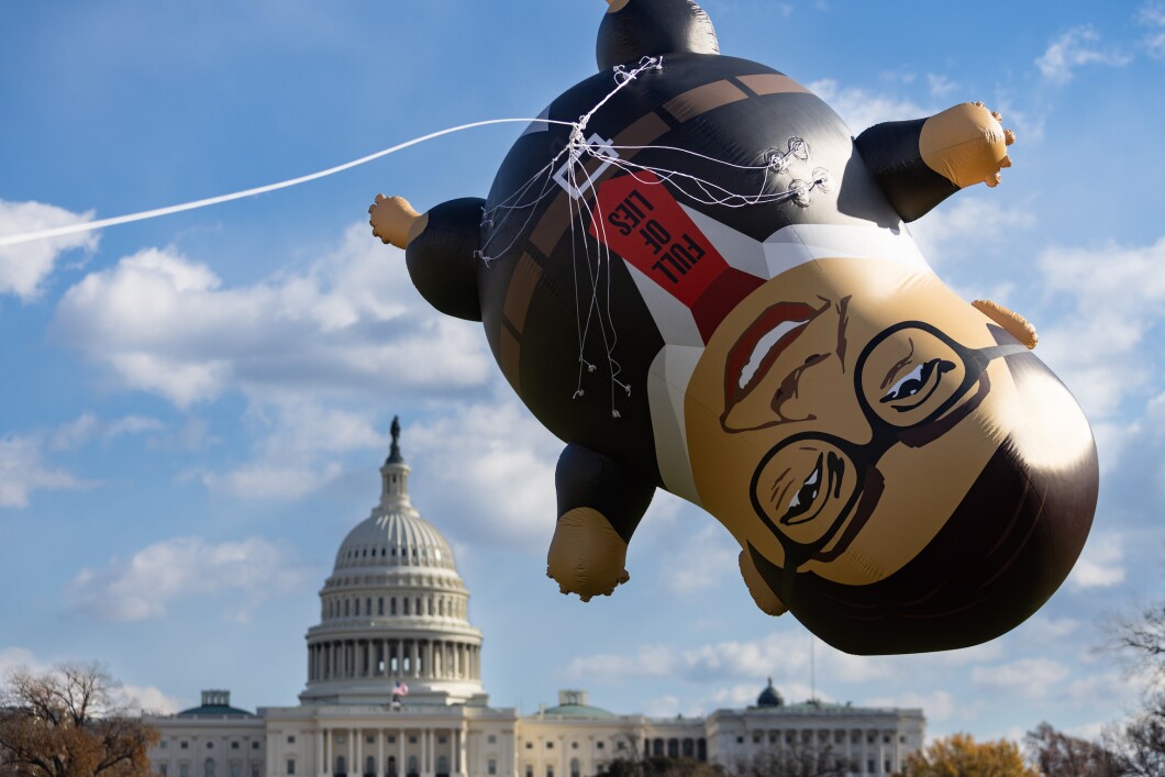 Activists with the advocacy group MoveOn display a 15-foot inflatable of Rep. George Santos (R-NY) on the National Mall on Wednesday, November 29, 2023. A House Ethics report in Santos found substantial evidence of fraud and ethics violations. On Friday the House voted to expel Santos from Congress. He Is the 6th lawmaker ever to be expelled from the House. 