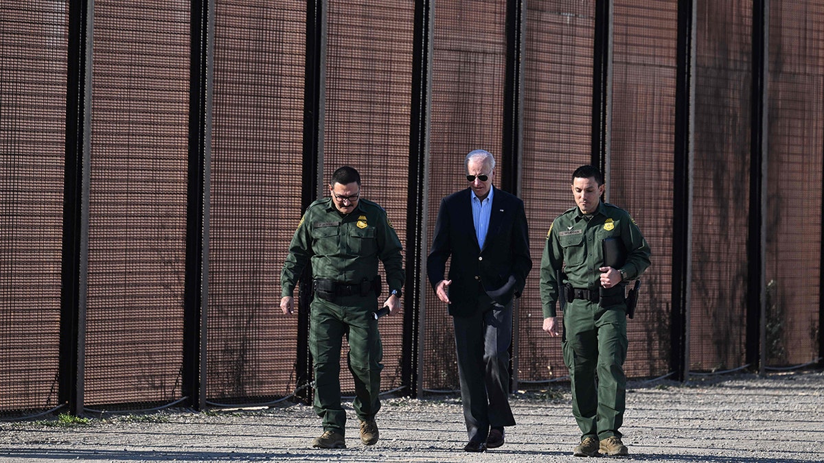 Biden walking with border officials