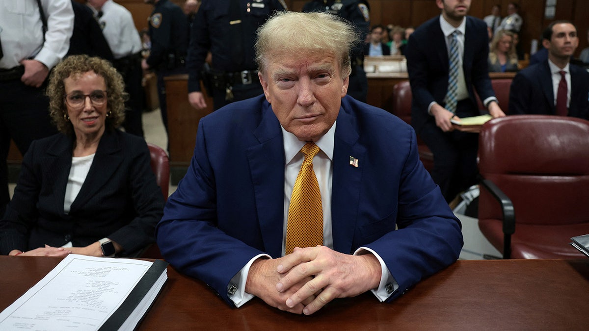 Donald Trump in yellow tie at trial