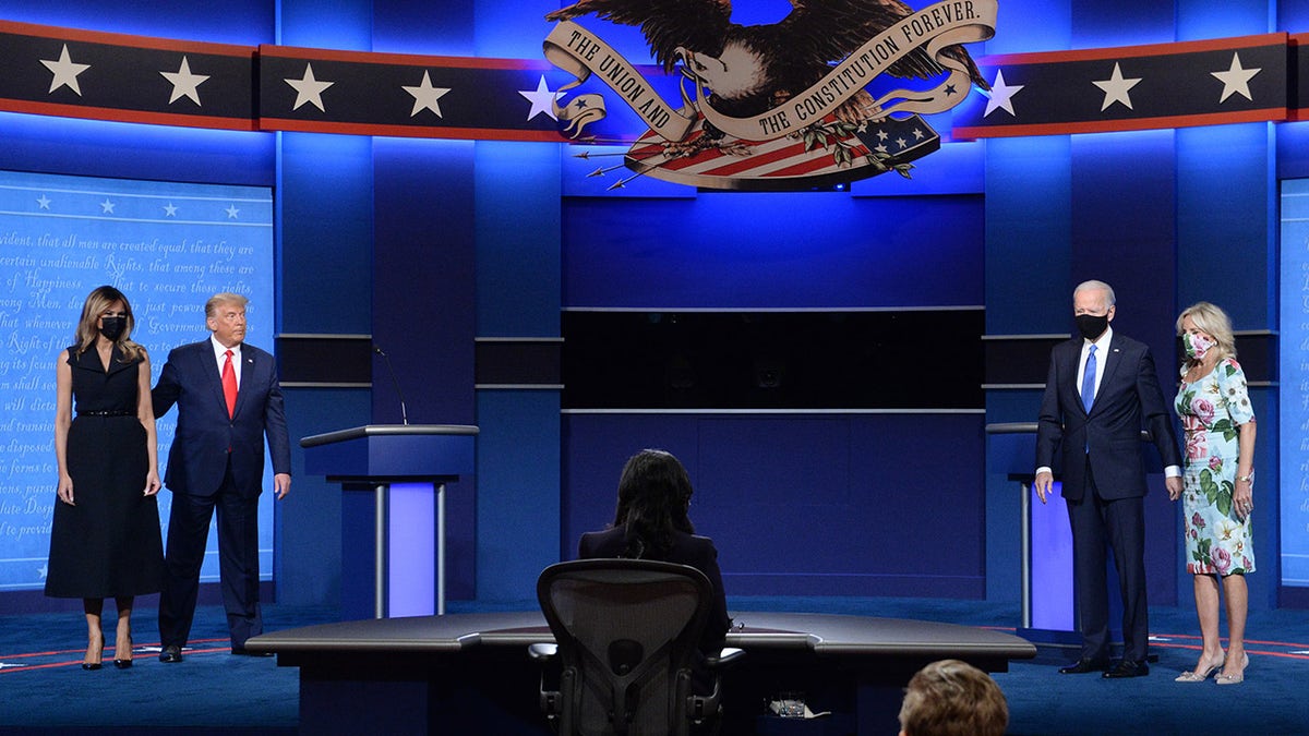 Trump and first lady Melania and Biden with wife Jill on debate stage in 2020