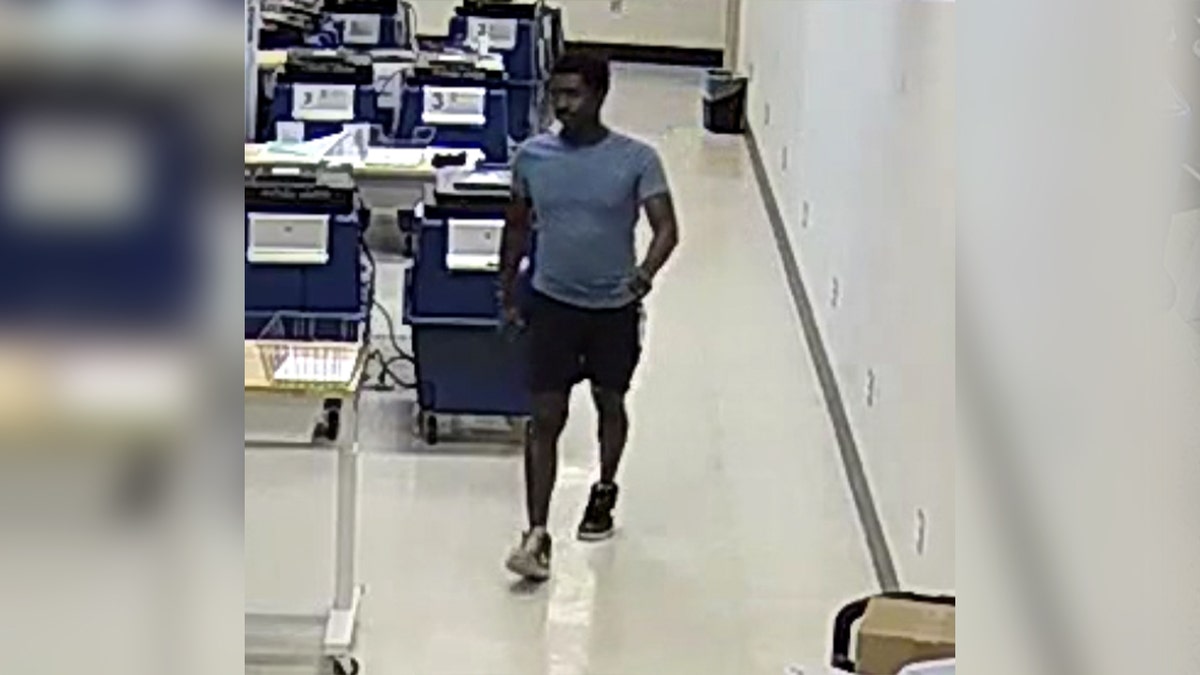 Walter Ringfield walking in tabulation room