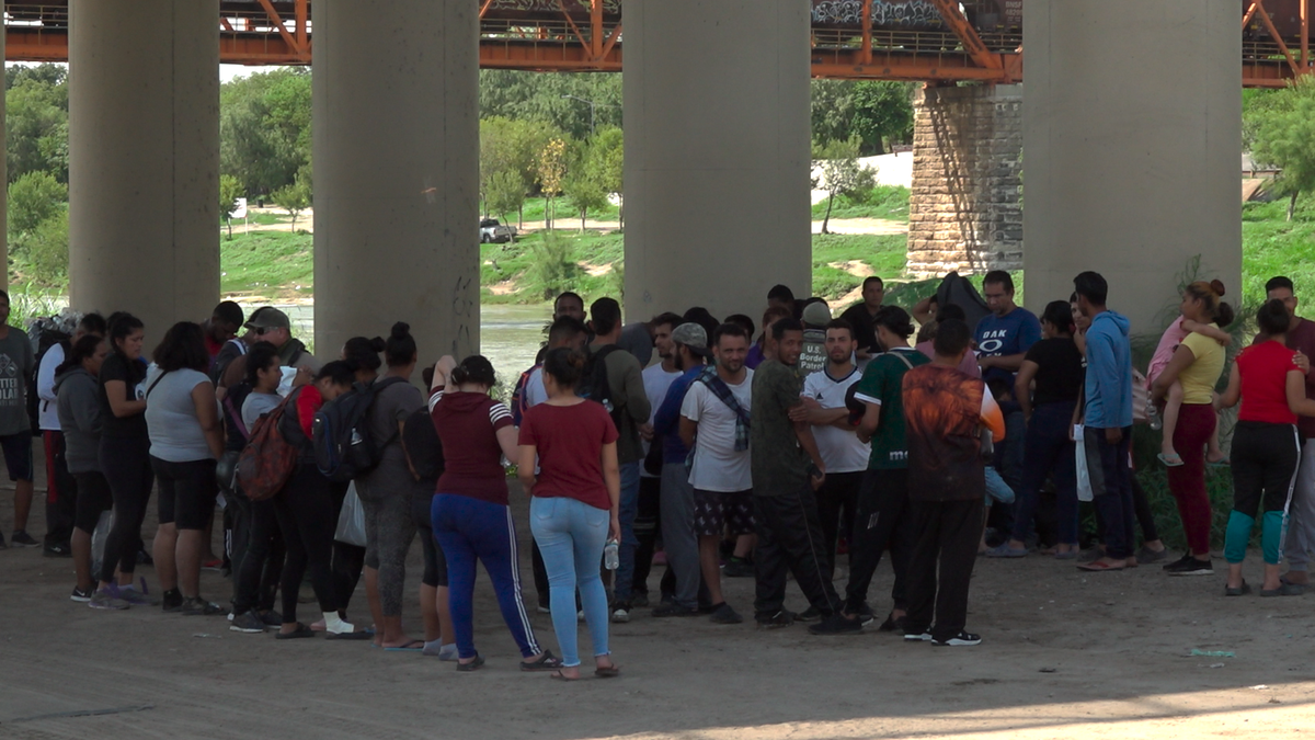 Migrants being processed by CBP