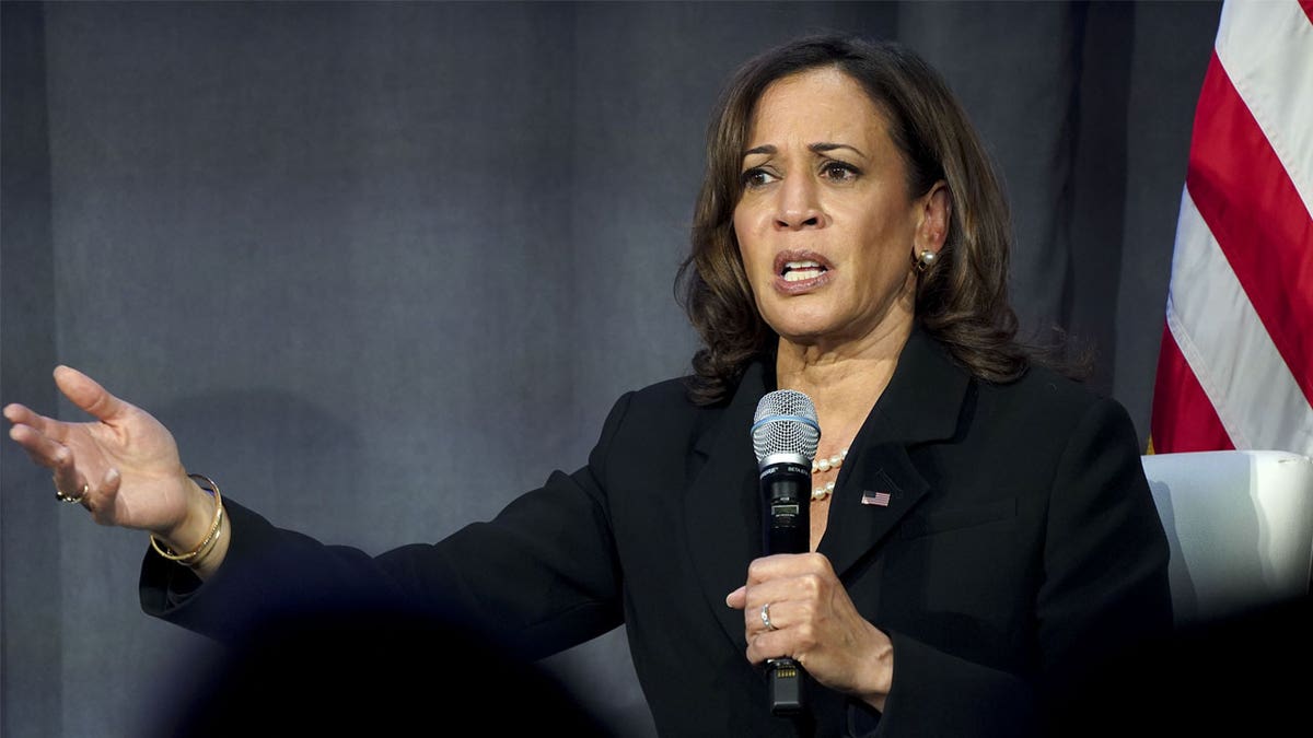 Kamala Harris holding mic