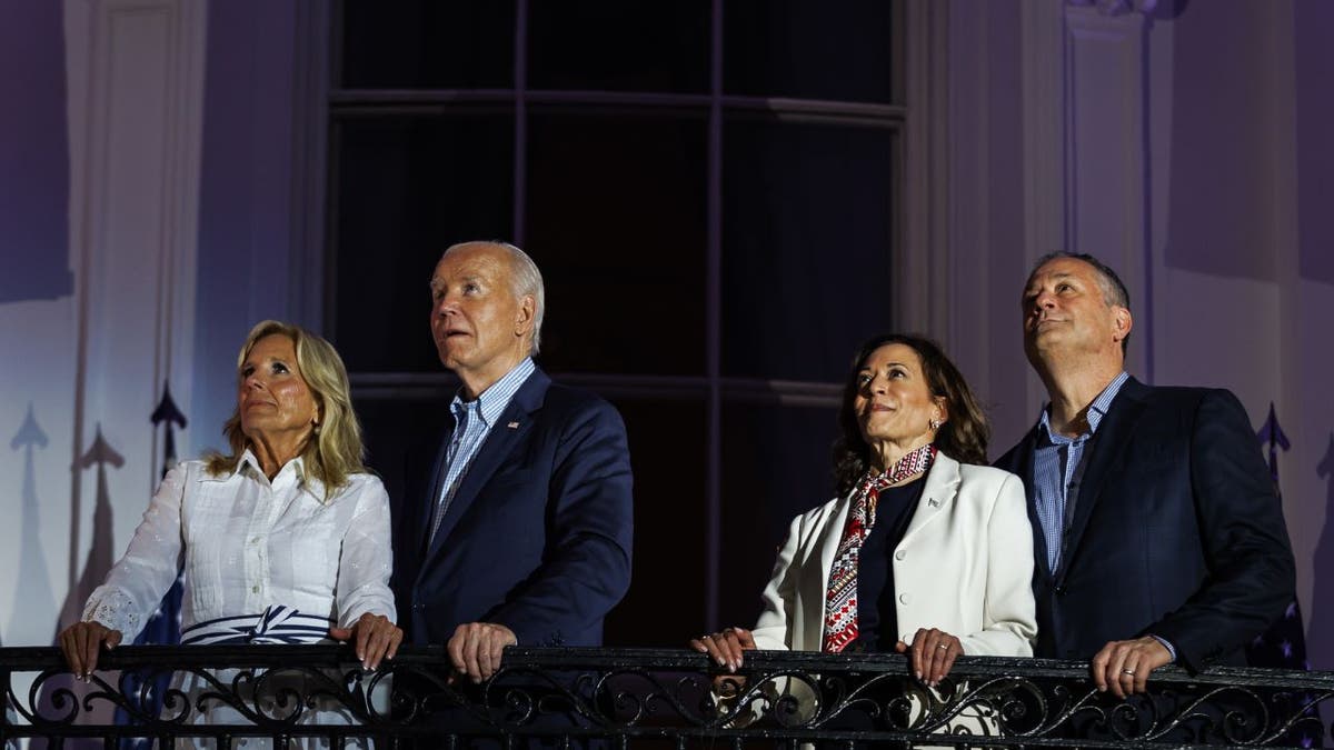 Emhoff standing near Biden